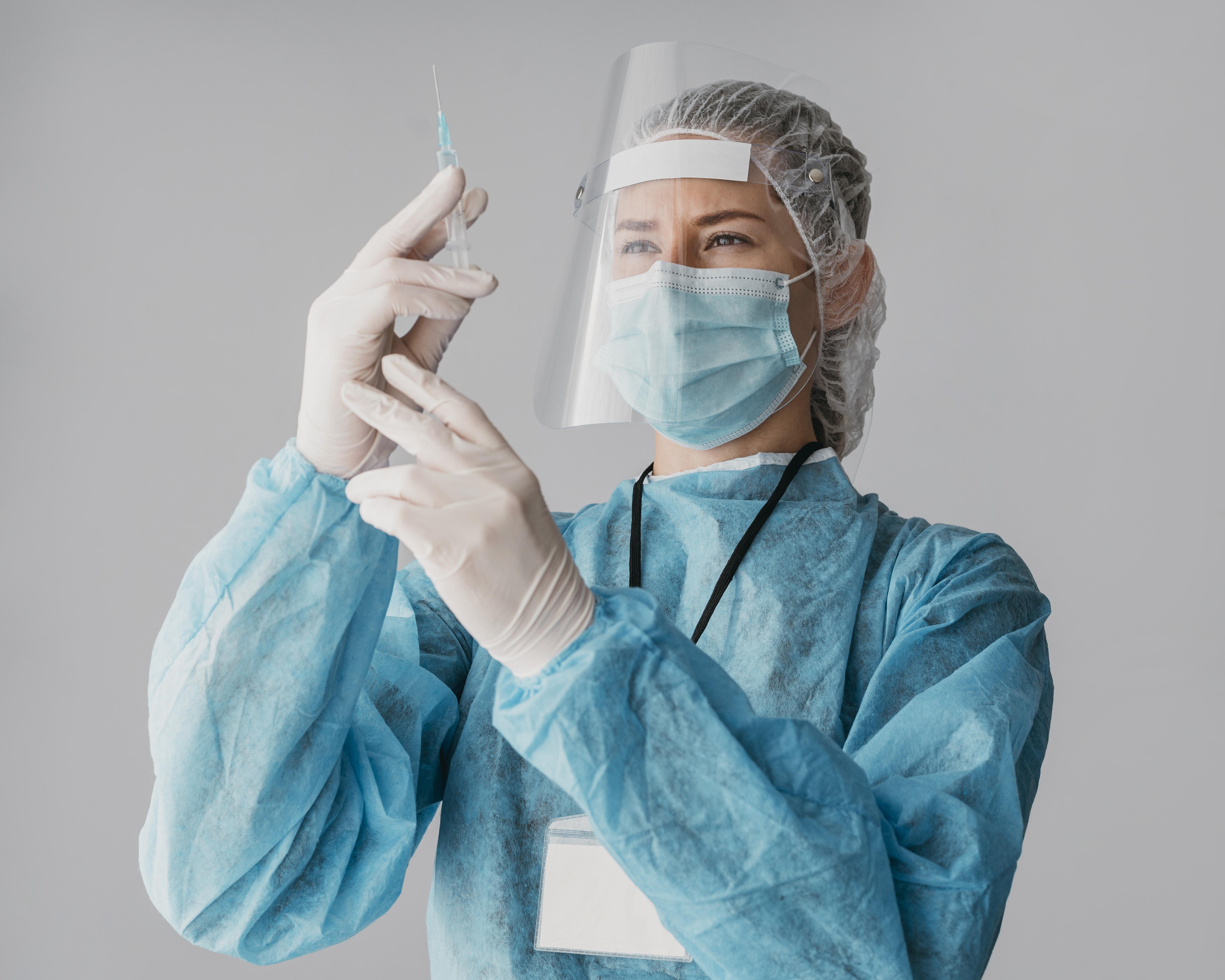 Healthcare worker getting ready to vaccinate a patient